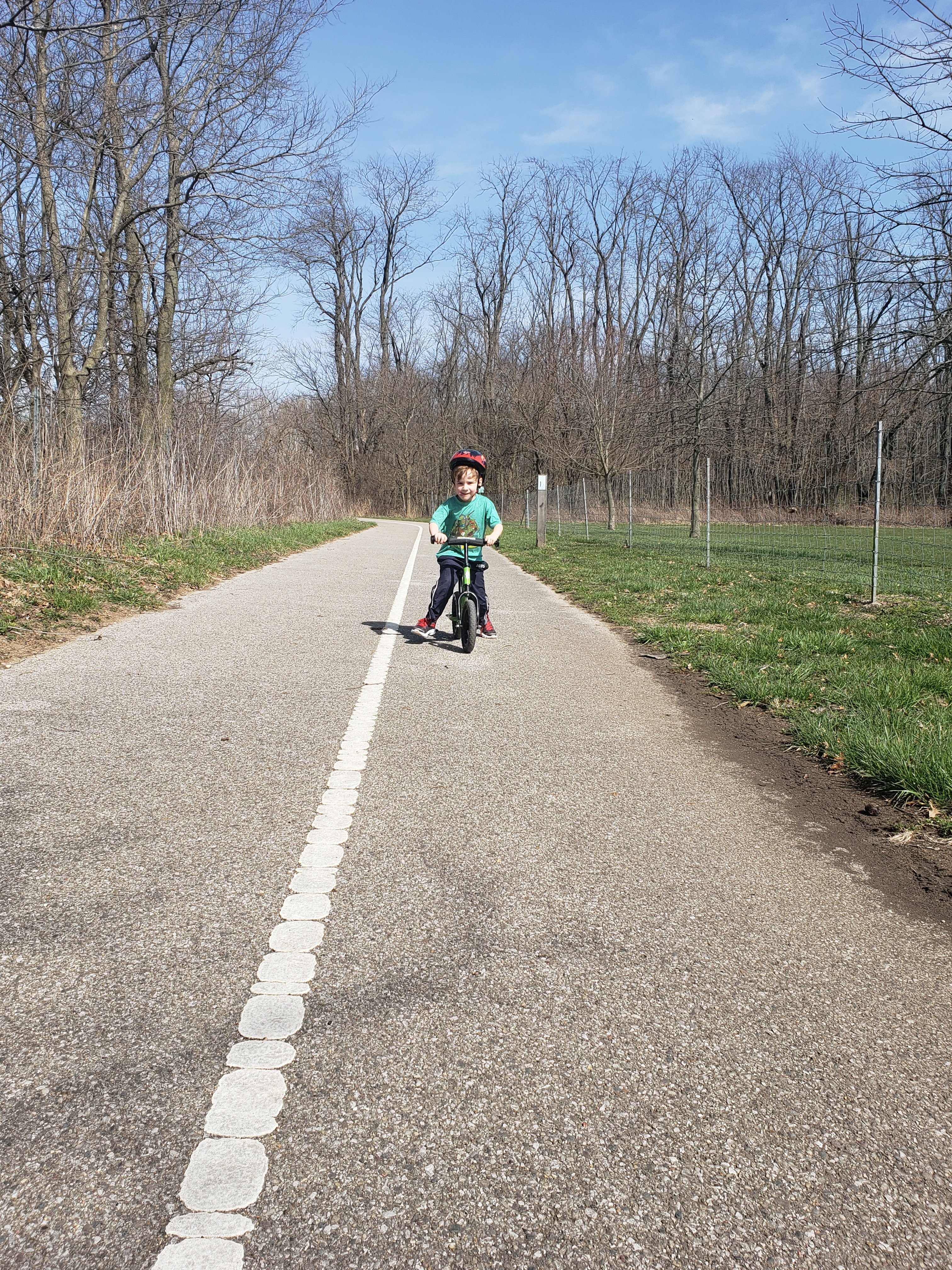 young boy on bike on Covington bike trail