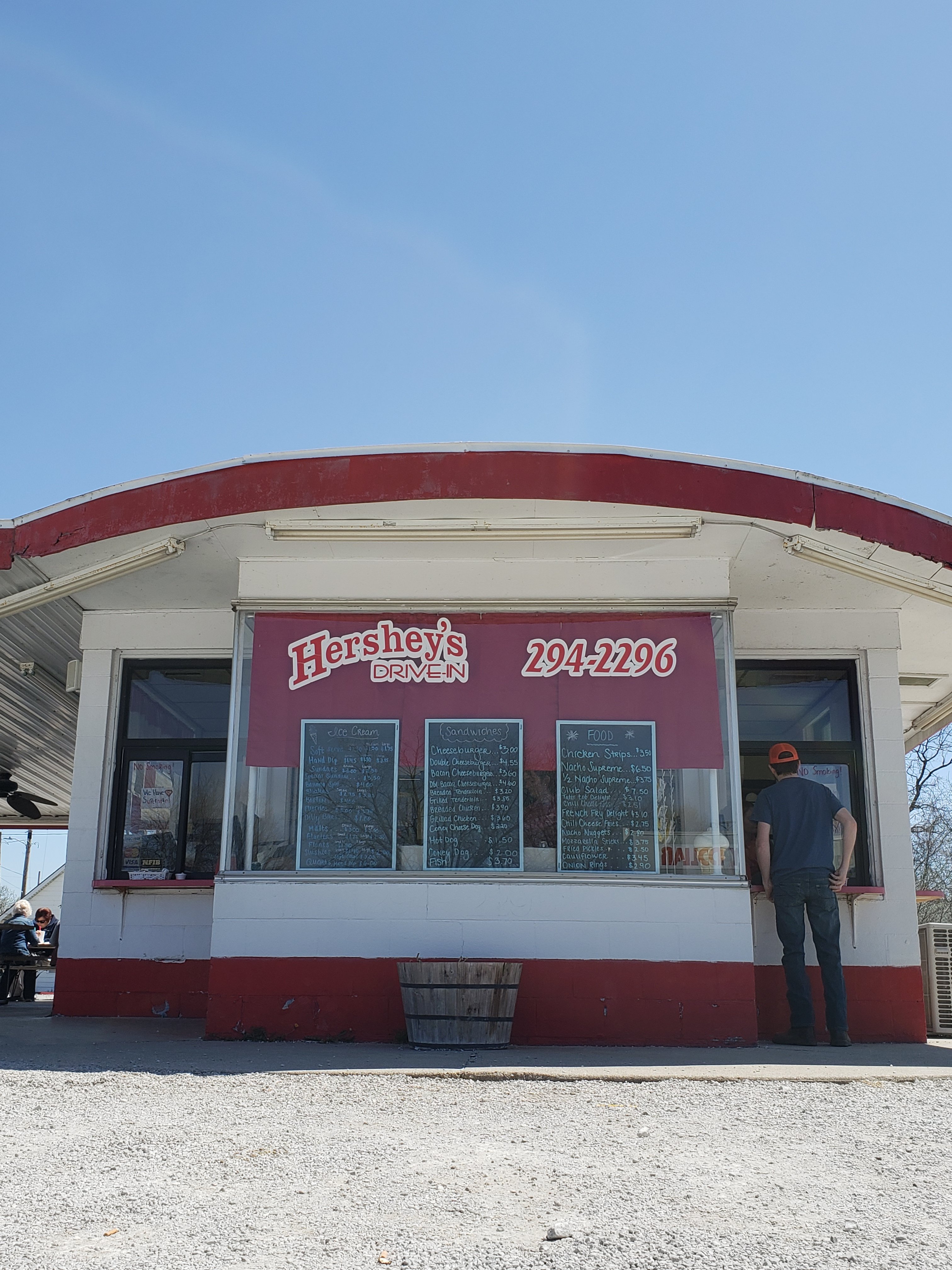 man standing at service window at Hershey’s Drive-In ice cream