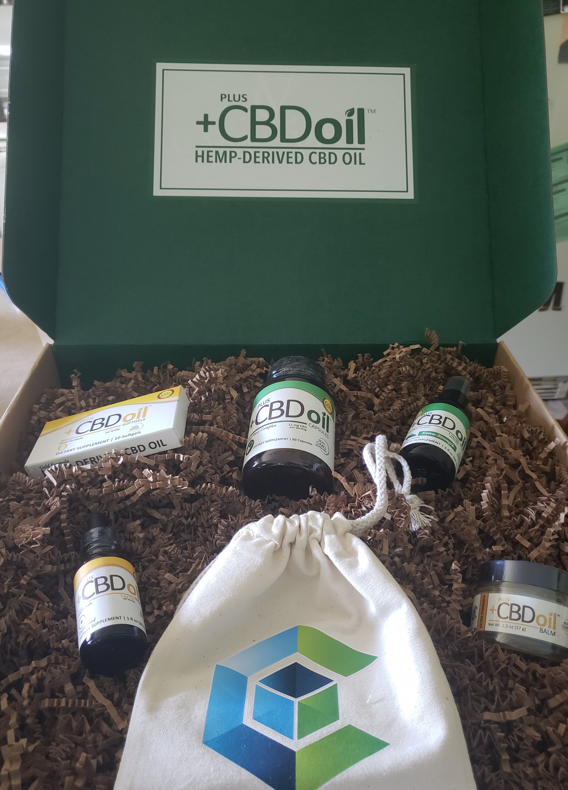 green CBD oil box filled with CBD Oil products