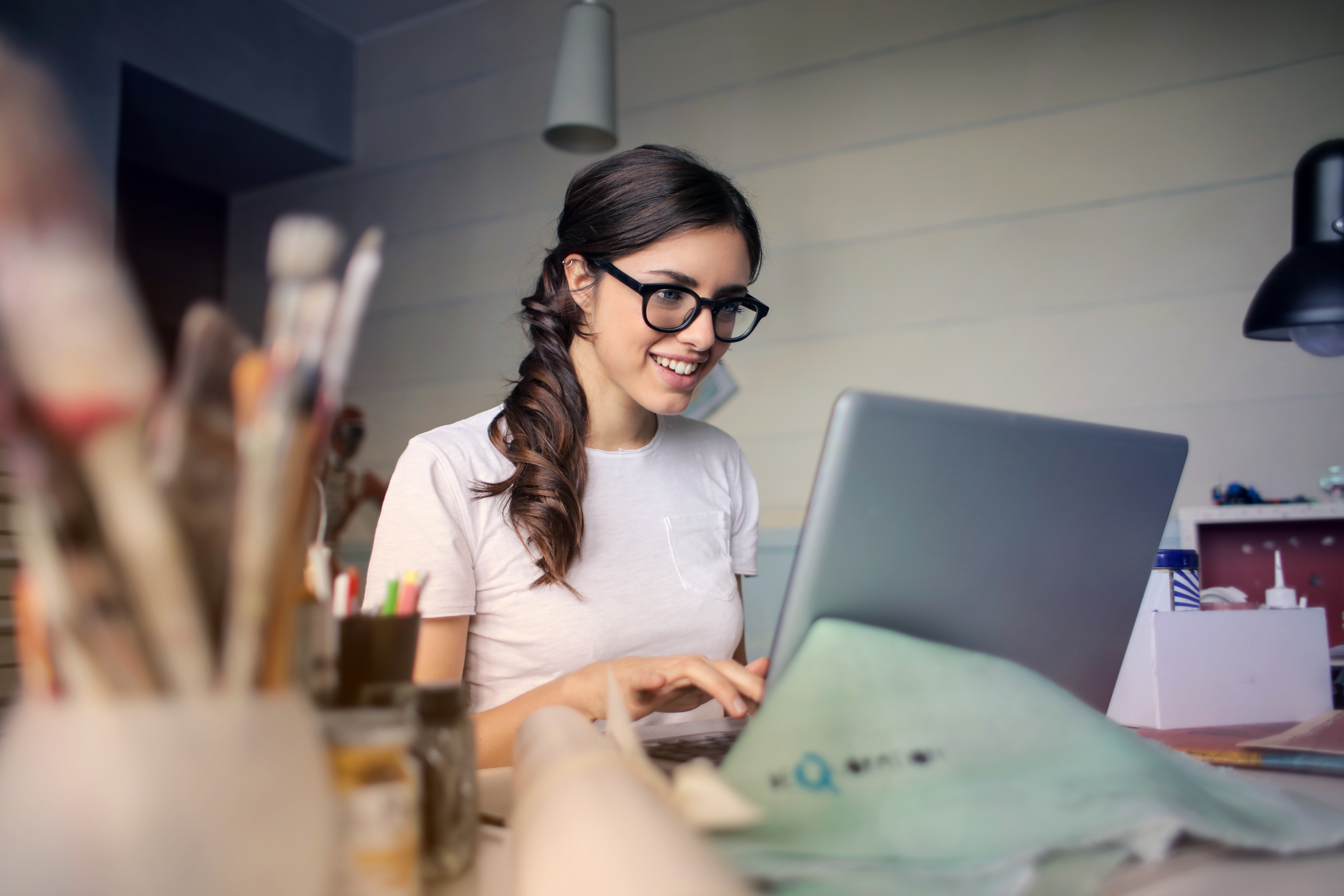 woman sitting in front of a laptop