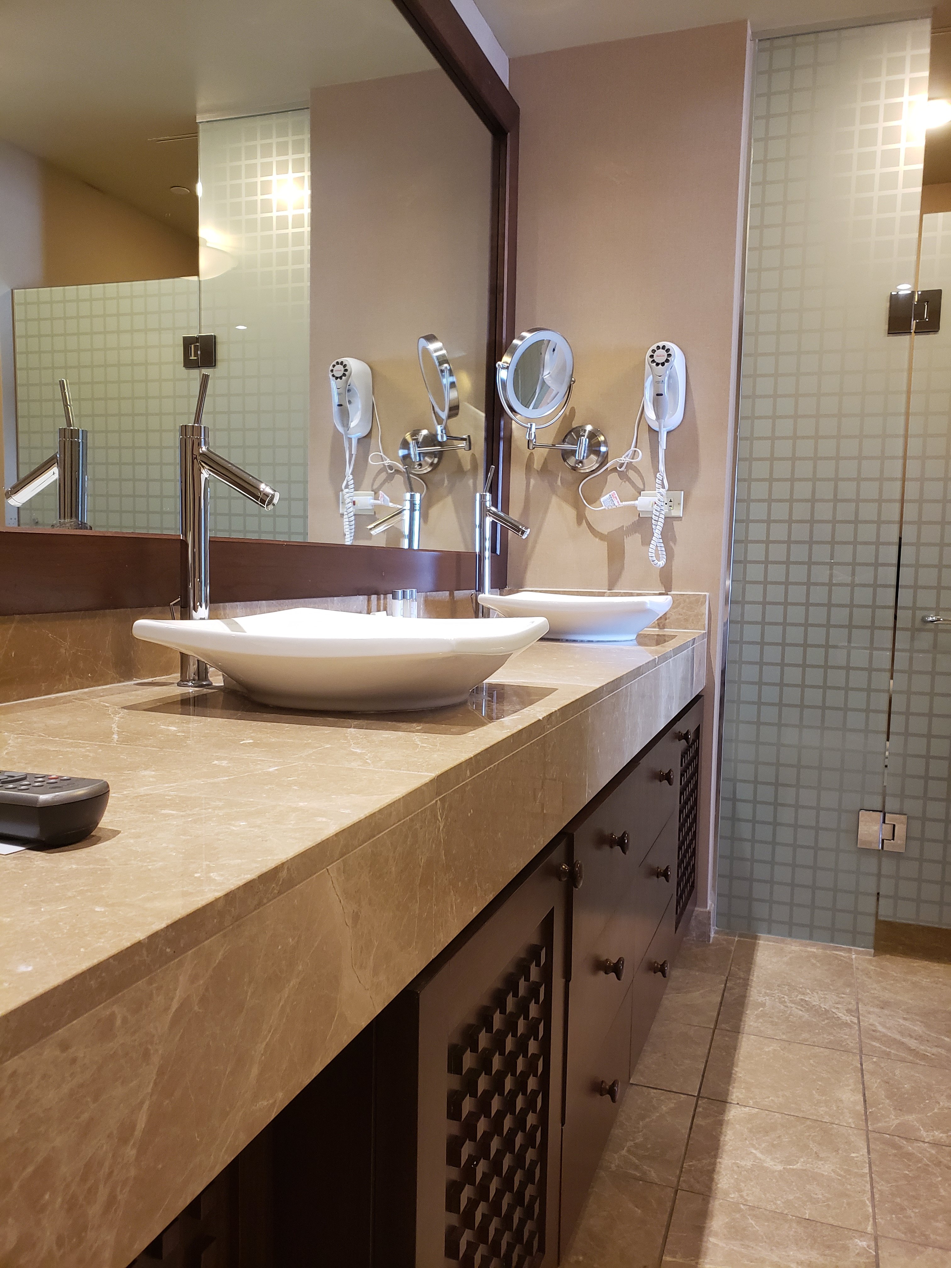 Isle Casino and Hotel Bettendorf room bathroom counter with double sinks, mirrors and hair dryer