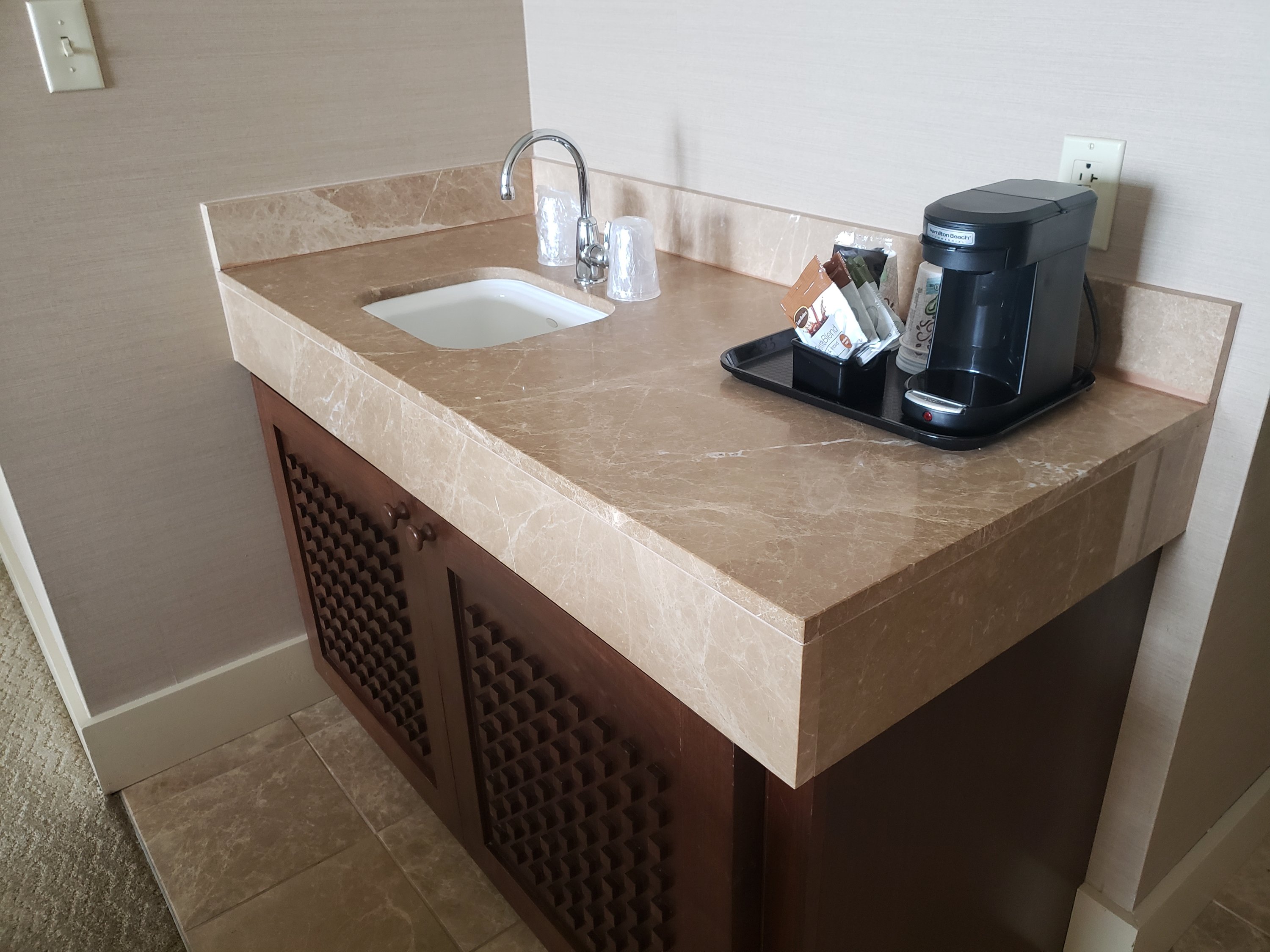 small coffee bar in the hotel room with sink