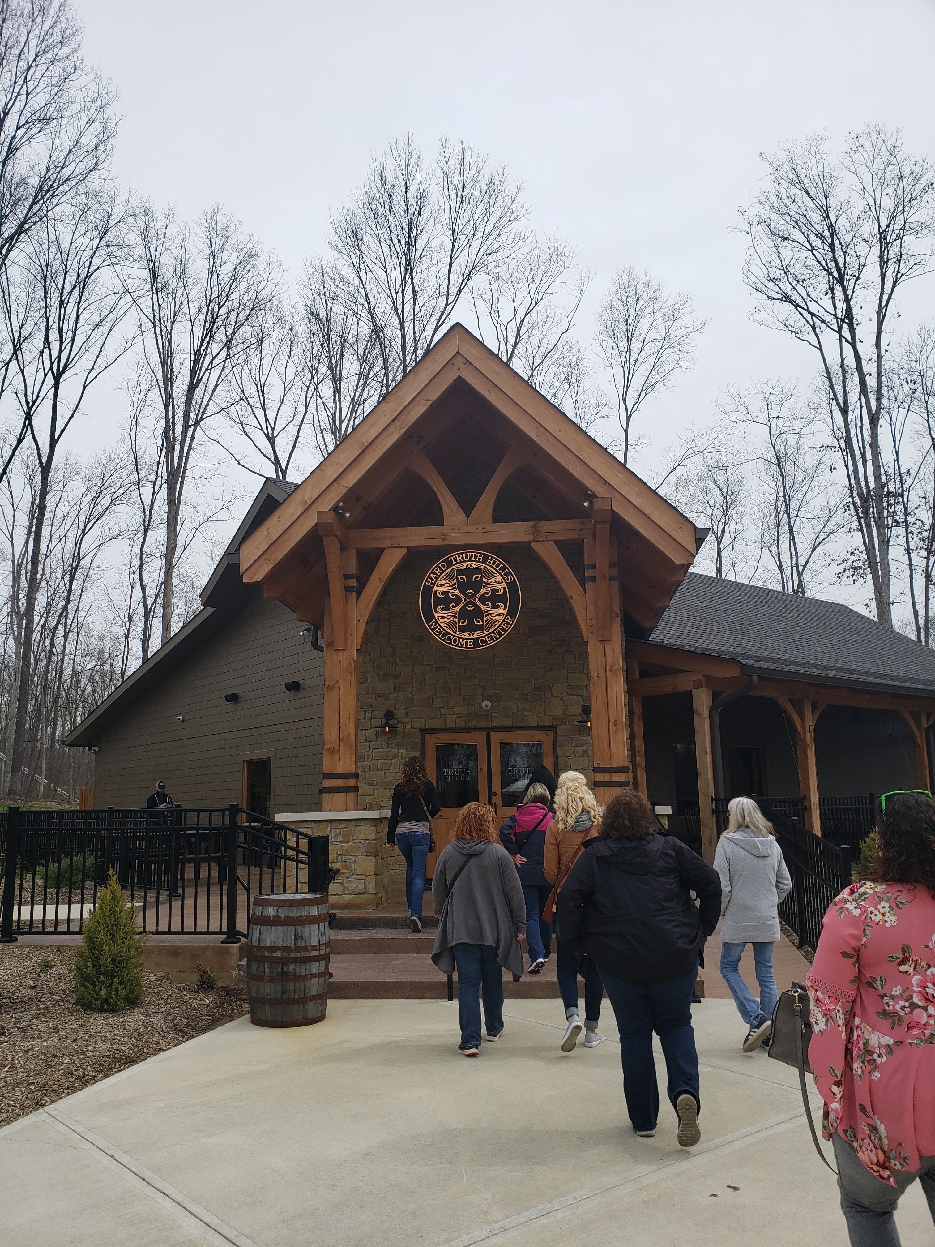 people walking into the front of the Hard Truth Hills Welcome Center