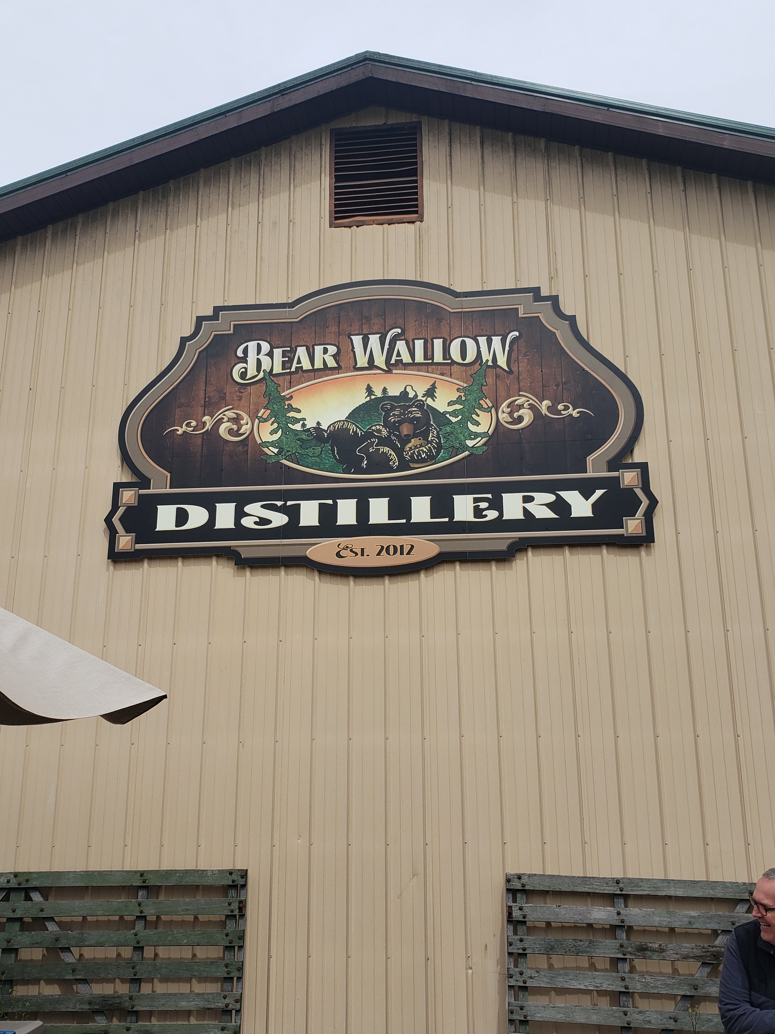 Bear Wallow Distillery Sign on front of building