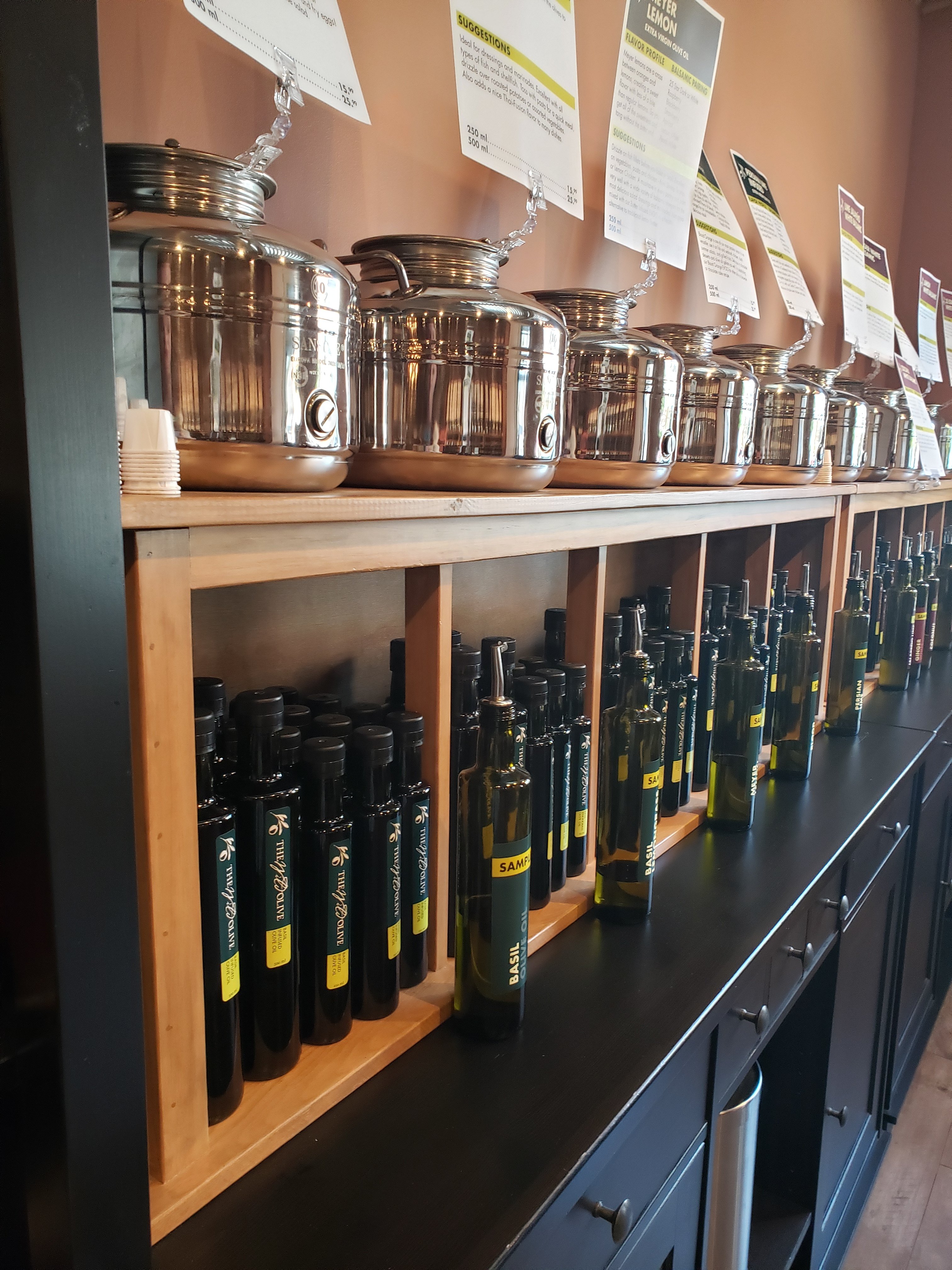 bottles of herb oils on a shelf